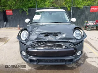 2019 MINI Hardtop 4 Door Cooper S z VIN WMWXU3C54K2H86856, wystawiony jako IAAI lot #42201474 z przebiegiem 56 610 mil mil oraz . Historia ofert i sprzedaży dostępna na DreamBid. Obrazek 12.