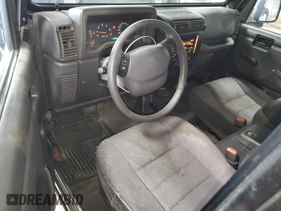 2002 Jeep Wrangler Sport with VIN 1J4FA49S62P713475, listed as a Copart auction lot 59299965 with 114,654 mi miles and Non repairable. Bid and sale history available at DreamBid. Image 8.