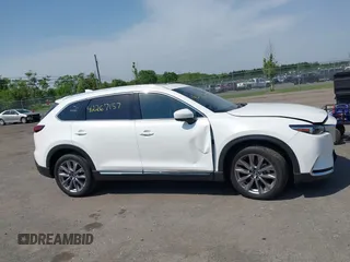 2021 Mazda CX-9 Grand Touring z VIN JM3TCBDY8M0537986, wystawiony jako IAAI lot #42267157 z przebiegiem 25 375 mil mil oraz . Historia ofert i sprzedaży dostępna na DreamBid. Obrazek 14.