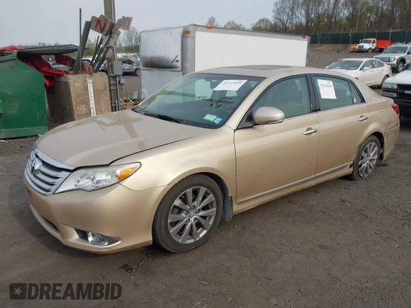 2011 Toyota Avalon with VIN 4T1BK3DB5BU414687, listed as a IAAI auction lot 42103830 with 130,045 mi miles and . Bid and sale history available at carsss.com. Image 2.