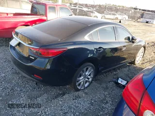 2017 Mazda Mazda6 Touring with VIN JM1GL1V59H1128257, listed as a IAAI auction lot 41503300 with 123,640 mi miles. Bid and sale history available at carsss.com. Image 4.
