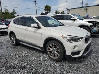 2017 BMW X1 xDrive28i with VIN WBXHT3Z37H4A55614, listed as a Copart auction lot 63491415 with 120,680 mi miles and Salvage title. Bid and sale history available at DreamBid. Image 4.
