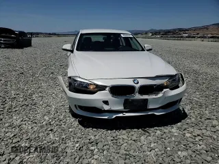 2014 BMW 3 Series 320i with VIN WBA3B1C55EK133687, listed as a Copart auction lot 63049945 with 95,604 mi miles and Salvage title. Bid and sale history available at DreamBid. Image 13.