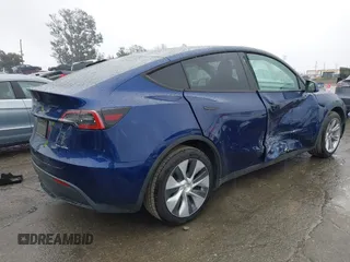 2022 Tesla Model Y Long Range with VIN 7SAYGDEE8NF511395, listed as a IAAI auction lot 41595310 with 65,156 mi miles and . Bid and sale history available at carsss.com. Image 4.