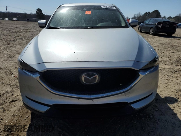 2021 Mazda CX-5 Grand Touring with VIN JM3KFADM6M0387094, listed as a Copart auction lot 48350845 with 94,701 mi miles and Salvage Title. Bid and sale history available at carsss.com. Image 5.