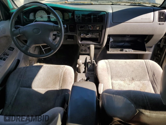 2004 Toyota Tacoma z VIN 5TEWN72N74Z389013, wystawiony jako Copart lot #55796005 z przebiegiem 199 637 mil mil oraz Czysty tytuł • Clean title. Historia ofert i sprzedaży dostępna na DreamBid. Obrazek 8.