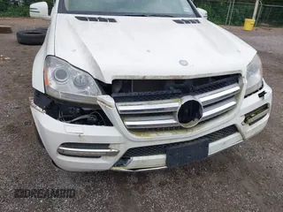 2012 Mercedes-Benz GL 450 z VIN 4JGBF7BE5CA790009, wystawiony jako IAAI lot #42314378 z przebiegiem 156 090 mil mil oraz . Historia ofert i sprzedaży dostępna na DreamBid. Obrazek 6.