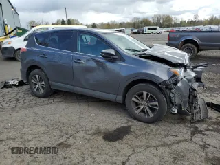 2018 Toyota RAV4 XLE with VIN 2T3RFREV2JW791353, listed as a Copart auction lot 51588515 with 126,830 mi miles and Salvage Title. Bid and sale history available at DreamBid. Image 4.