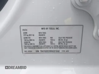 2024 Tesla Model Y with VIN 7SAYGDED9RA331840, listed as a IAAI auction lot 42350926 with 13,818 mi miles and . Bid and sale history available at DreamBid. Image 9.