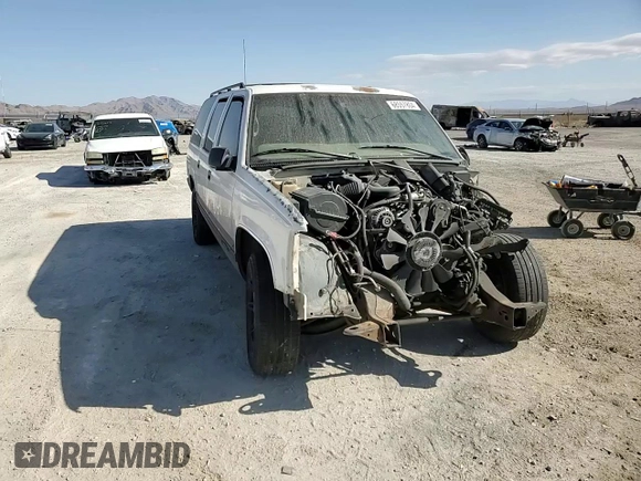 1998 GMC Suburban z VIN 1GKEC16R0WJ712847, wystawiony jako Copart lot #68557804 z przebiegiem 262 538 mil mil oraz Szkoda całkowita • Salvage title. Historia ofert i sprzedaży dostępna na DreamBid. Obrazek 11.
