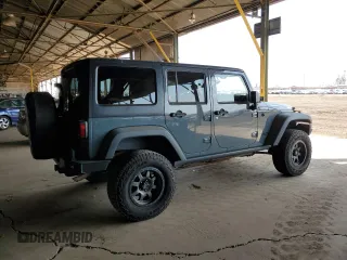 2014 Jeep Wrangler Unlimited Rubicon with VIN 1C4BJWFG4EL141706, listed as a Copart auction lot 51305235 with 106,919 mi miles and Salvage Title. Bid and sale history available at carsss.com. Image 3.
