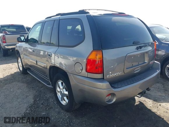 2005 GMC Envoy SLE with VIN 1GKDS13S452306939, listed as a IAAI auction lot 41931667 with 236,955 mi miles and . Bid and sale history available at DreamBid. Image 3.