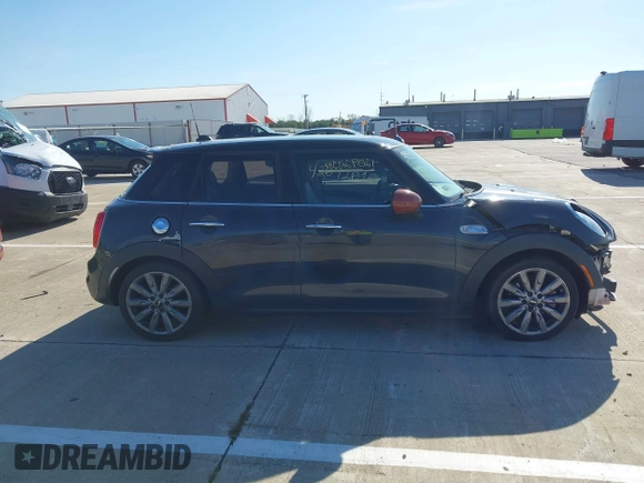 2015 MINI Hardtop 4 Door S with VIN WMWXU3C57FT892179, listed as a IAAI auction lot 42092010 with 95,156 mi miles and . Bid and sale history available at DreamBid. Image 14.