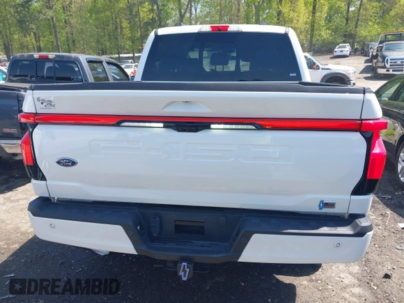 2022 Ford F-150 Lightning Pro z VIN 1FTVW1EL3NWG16227, wystawiony jako IAAI lot #41994584 z przebiegiem 23 341 mil mil oraz . Historia ofert i sprzedaży dostępna na DreamBid. Obrazek 16.