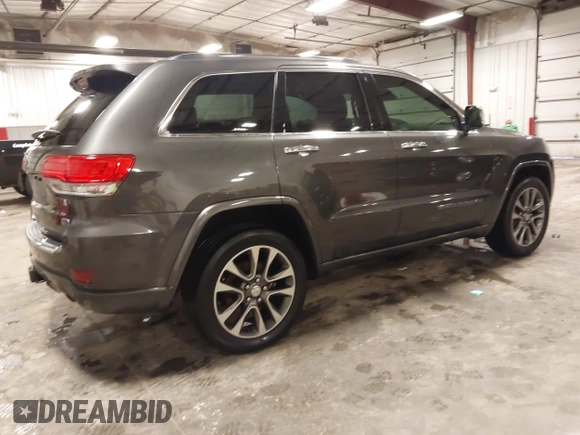 2017 Jeep Grand Cherokee Overland z VIN 1C4RJFCG6HC641812, wystawiony jako IAAI lot #42053404 z przebiegiem 129 184 mil mil oraz . Historia ofert i sprzedaży dostępna na DreamBid. Obrazek 4.