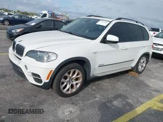 2011 BMW X5 35i with VIN 5UXZV4C54BL412770, listed as a IAAI auction lot 41618946 with 148,612 mi miles. Bid and sale history available at carsss.com. Image 2.