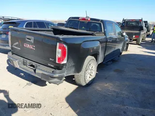 2016 GMC Canyon 2WD SLT with VIN 1GTG5DE35G1102893, listed as a IAAI auction lot 41798727 with 151,166 mi miles. Bid and sale history available at carsss.com. Image 4.