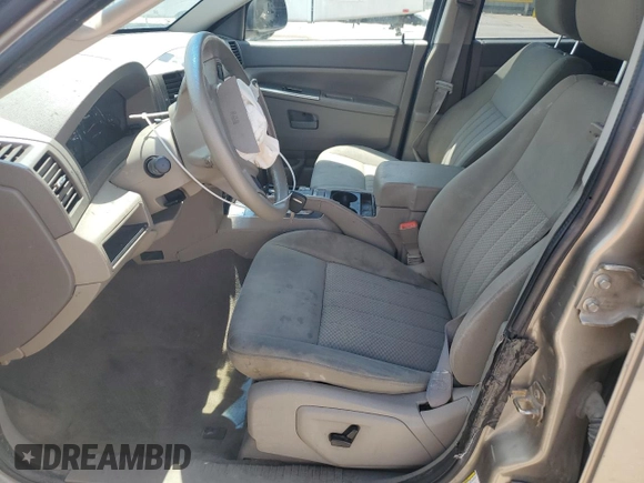 2005 Jeep Grand Cherokee Laredo with VIN 1J4HR48N65C608296, listed as a Copart auction lot 58862875 with 168,421 mi miles and Salvage title. Bid and sale history available at DreamBid. Image 7.