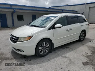 2014 Honda Odyssey Touring with VIN 5FNRL5H96EB009230, listed as a Copart auction lot 63561945 with 192,412 mi miles and Salvage title. Bid and sale history available at DreamBid. Image 1.