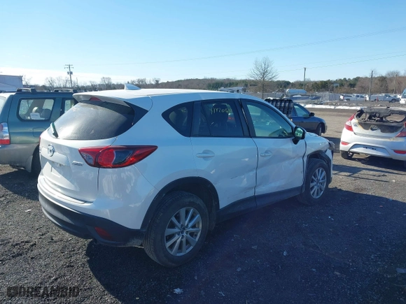2016 Mazda CX-5 Touring with VIN JM3KE4CYXG0917841, listed as a IAAI auction lot 41420641 with 75,710 mi miles. Bid and sale history available at carsss.com. Image 4.