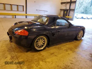 1999 Porsche Boxster z VIN WP0CA2983XU630435, wystawiony jako Copart lot #47402785 z przebiegiem 62 180 mil mil oraz Szkoda całkowita • Salvage title. Historia ofert i sprzedaży dostępna na DreamBid. Obrazek 3.