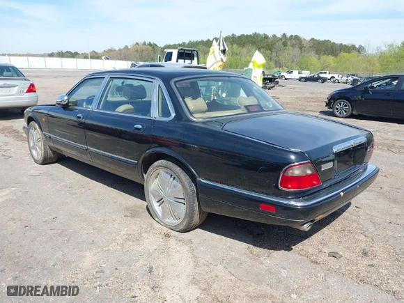1996 Jaguar XJ Series Sedan Vanden Plas with VIN SAJKX6245TC780444, listed as a IAAI auction lot 41856403 with 1 mi miles. Bid and sale history available at carsss.com. Image 3.