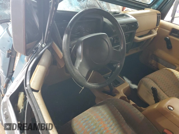 1997 Jeep Wrangler Sport with VIN 1J4FY19SXVP537075, listed as a Copart auction lot 61389915 with Not provided miles and Salvage title. Bid and sale history available at DreamBid. Image 8.