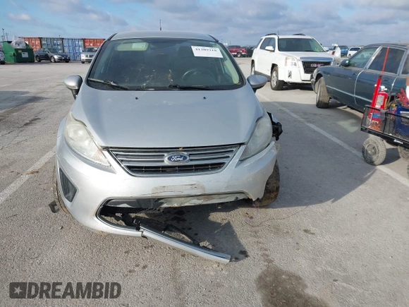 2015 Ford Fiesta SE z VIN 3FADP4BJ1FM220222, wystawiony jako IAAI lot #41209318 z przebiegiem 113 134 mil mil oraz . Historia ofert i sprzedaży dostępna na DreamBid. Obrazek 12.