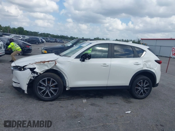 2018 Mazda CX-5 Touring z VIN JM3KFACM6J1419663, wystawiony jako IAAI lot #41879677 z przebiegiem 115 224 mil mil oraz . Historia ofert i sprzedaży dostępna na DreamBid. Obrazek 14.