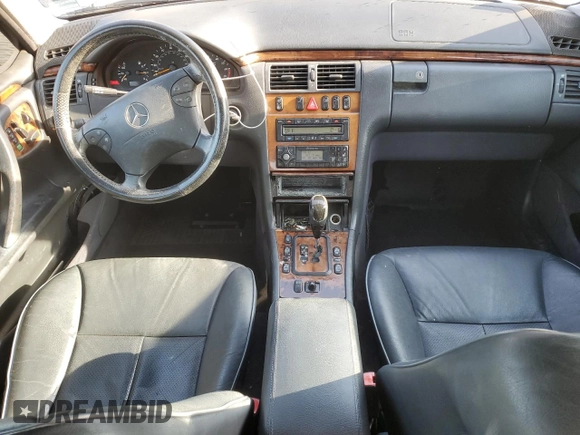 2002 Mercedes-Benz E-Class with VIN WDBJF65J22B490275, listed as a Copart auction lot 51128565 with 142,232 mi miles and Salvage Title. Bid and sale history available at carsss.com. Image 8.