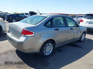 2008 Ford Focus SE with VIN 1FAHP35N68W154490, listed as a IAAI auction lot 42128643 with 141,316 mi miles. Bid and sale history available at carsss.com. Image 4.