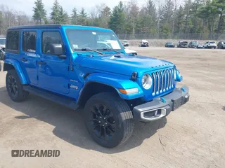 2023 Jeep Wrangler Sahara z VIN 1C4JJXP62PW662268, wystawiony jako IAAI lot #42107388 z przebiegiem 51 600 mil mil oraz . Historia ofert i sprzedaży dostępna na DreamBid. Obrazek 1.