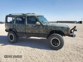 1999 Jeep Cherokee Sport with VIN 1J4FF68S6XL645028, listed as a Copart auction lot 48897255 with 218,552 mi miles and Salvage Title. Bid and sale history available at carsss.com. Image 4.