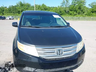 2011 Honda Odyssey EX-L with VIN 5FNRL5H66BB058333, listed as a IAAI auction lot 42172045 with 215,723 mi miles and . Bid and sale history available at carsss.com. Image 12.