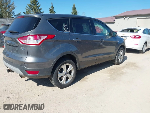 2014 Ford Escape SE with VIN 1FMCU9G99EUB13371, listed as a IAAI auction lot 42167417 with 140,145 mi miles and . Bid and sale history available at DreamBid. Image 4.