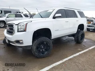 2019 GMC Yukon SLT with VIN 1GKS2BKC1KR167766, listed as a IAAI auction lot 41902532 with 97,793 mi miles. Bid and sale history available at carsss.com. Image 2.