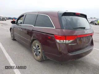 2014 Honda Odyssey Touring with VIN 5FNRL5H94EB127695, listed as a IAAI auction lot 41936109 with 221,786 mi miles and . Bid and sale history available at DreamBid. Image 3.