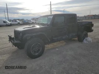 2021 Jeep Gladiator Rubicon с VIN 1C6JJTBG0ML593089, выставлен на аукционе Copart как лот 44372055 с пробегом 53 700 миль миль и Списание • Salvage title. История ставок и продаж доступна на DreamBid. Изображение 1.