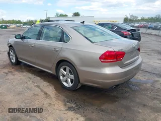 2015 Volkswagen Passat 1.8T Limited Edition with VIN 1VWAT7A32FC120769, listed as a IAAI auction lot 42013547 with 61,451 mi miles. Bid and sale history available at carsss.com. Image 3.