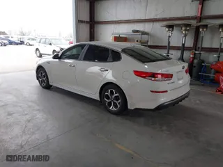 2019 Kia Optima LX with VIN 5XXGT4L37KG320078, listed as a IAAI auction lot 41598649 with 128,439 mi miles. Bid and sale history available at carsss.com. Image 3.