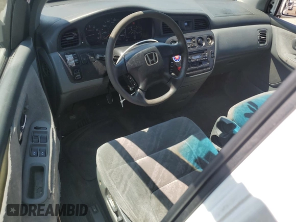 2002 Honda Odyssey EX with VIN 2HKRL18662H562178, listed as a Copart auction lot 63787995 with 256,072 mi miles and Salvage title. Bid and sale history available at DreamBid. Image 8.