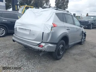 2016 Toyota RAV4 LE with VIN 2T3ZFREV2GW249128, listed as a IAAI auction lot 41696489 with 115,816 mi miles. Bid and sale history available at carsss.com. Image 4.