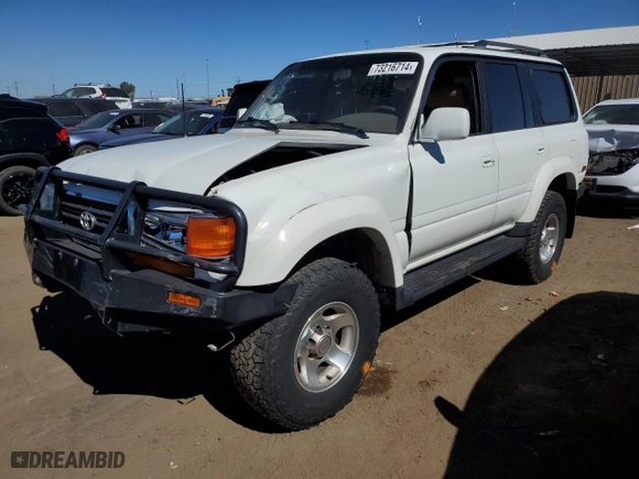 1997 Toyota Land Cruiser with VIN JT3HJ85J2V0180979, listed as a Copart auction lot 73216714 with 239,444 mi miles and Salvage Title. Bid and sale history available at carsss.com. Image 1.