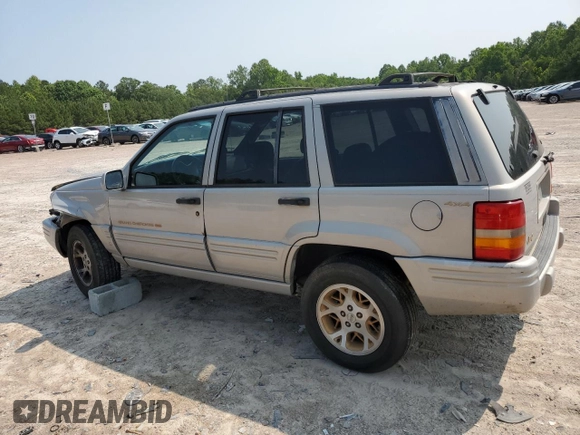 1998 Jeep Grand Cherokee Limited with VIN 1J4GZ78Y5WC324828, listed as a Copart auction lot 58992125 with 225,705 mi miles and Salvage title. Bid and sale history available at DreamBid. Image 2.