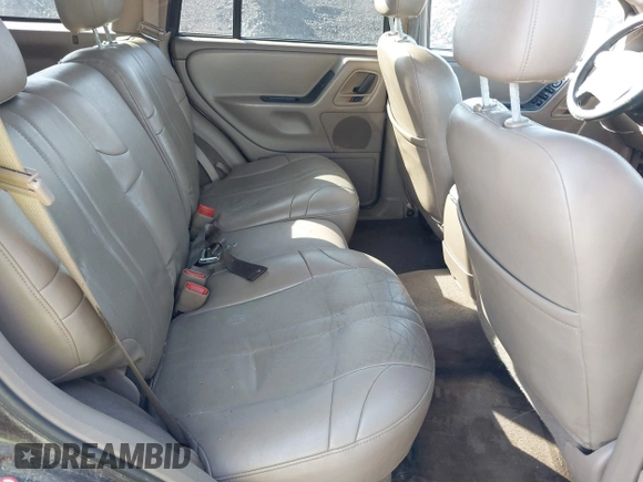 2004 Jeep Grand Cherokee with VIN 1J8GX48S24C266933, listed as a IAAI auction lot 41497122 with 200,899 mi miles and . Bid and sale history available at DreamBid. Image 8.