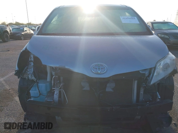 2014 Toyota Sienna LE AAS with VIN 5TDKK3DC1ES520561, listed as a IAAI auction lot 41959565 with 115,908 mi miles and . Bid and sale history available at carsss.com. Image 6.