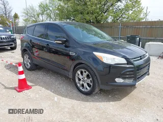 2013 Ford Escape SEL with VIN 1FMCU9H92DUA45282, listed as a IAAI auction lot 42184946 with 96,512 mi miles and . Bid and sale history available at DreamBid. Image 1.