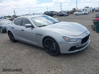 2015 Maserati Ghibli S Q4 with VIN ZAM57RTA9F1130058, listed as a IAAI auction lot 42084434 with 65,984 mi miles. Bid and sale history available at carsss.com. Image 1.