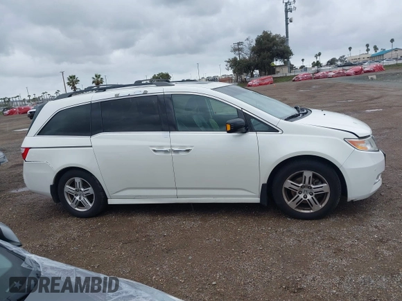 2013 Honda Odyssey Touring with VIN 5FNRL5H99DB041328, listed as a IAAI auction lot 41797520 with 148,523 mi miles and . Bid and sale history available at carsss.com. Image 13.