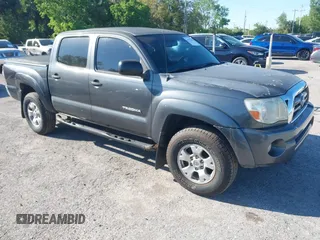 2009 Toyota Tacoma PreRunner with VIN 3TMJU62N59M088137, listed as a IAAI auction lot 41775410 with 217,331 mi miles. Bid and sale history available at carsss.com. Image 1.